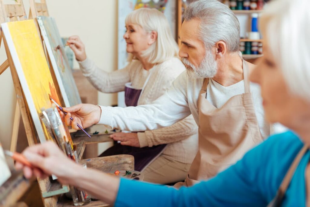 Proveer at Port City | Seniors participating in painting activity